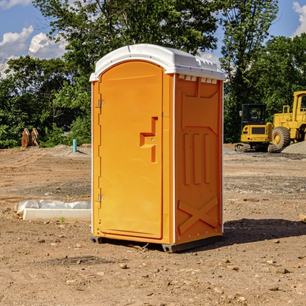 what is the cost difference between standard and deluxe portable restroom rentals in Calvin